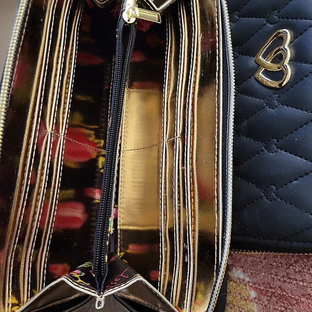 Brand new Betsy Johnson one side ivory back is black and gold inside Pretty!!!!!